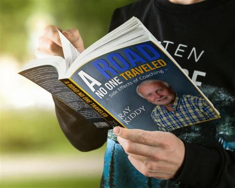 Book jackiet of Ray Kiddy's memoir, A Road No One Traveled.